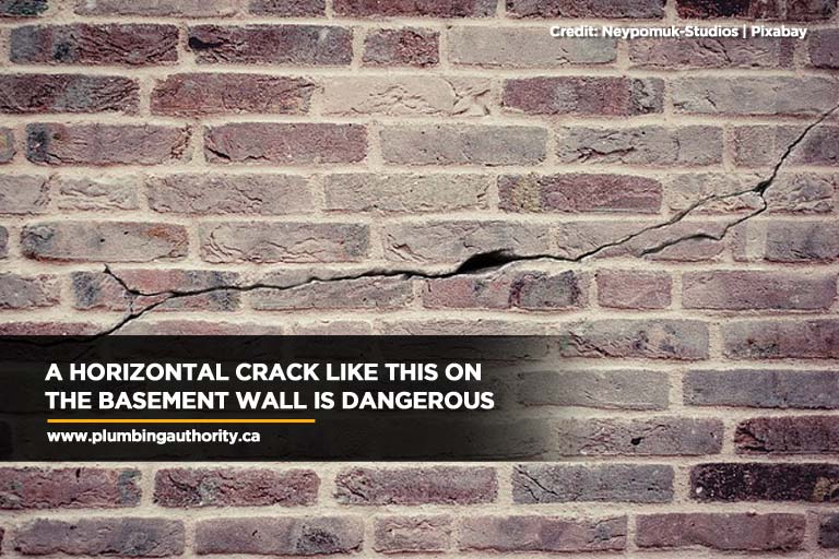 A horizontal crack like this on the basement wall is dangerous