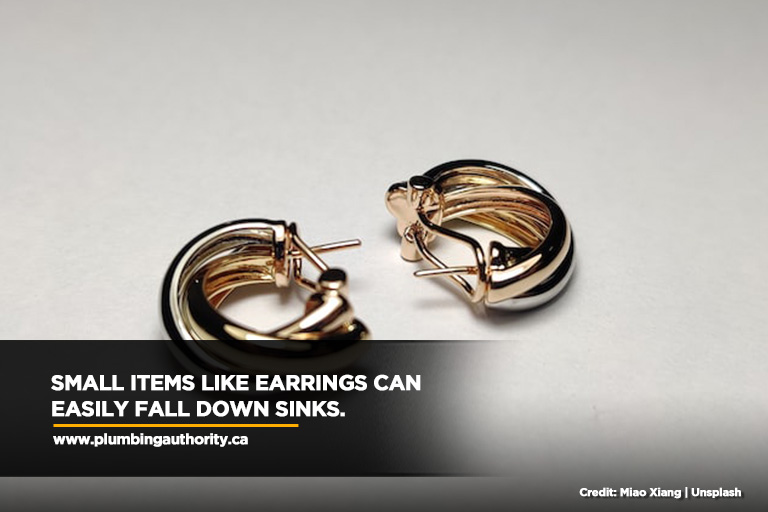 Small items like earrings can easily fall down sinks.
